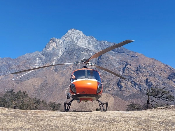 The Everest helicopter tour aircraft landing at the highest viewpoint in the Khumbu region.